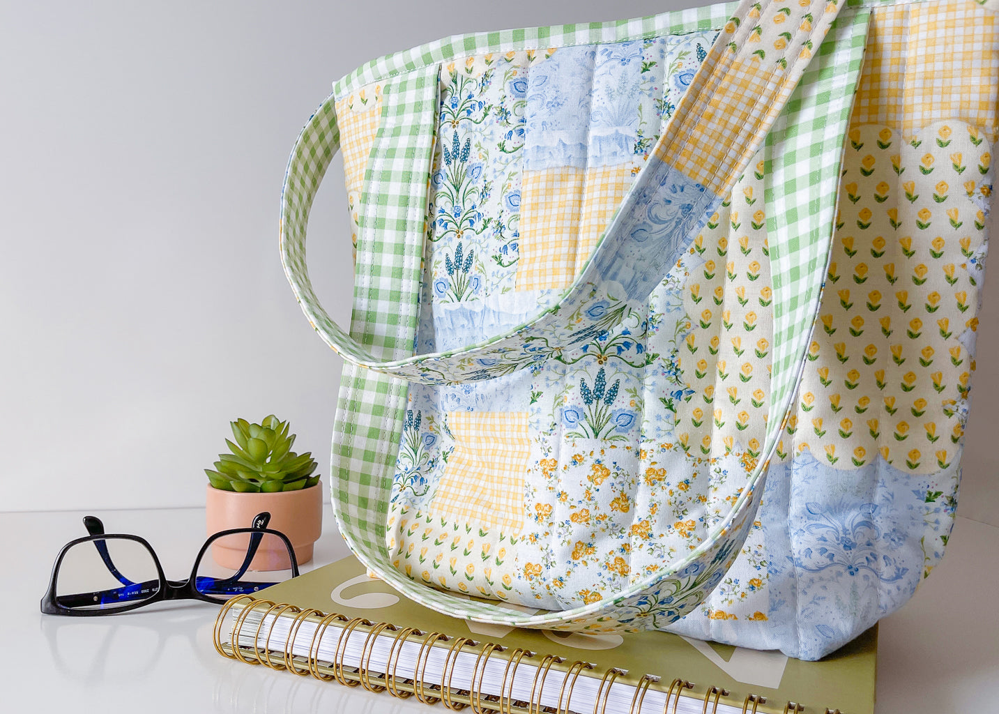 Fabric bag with floral pattern on a white surface