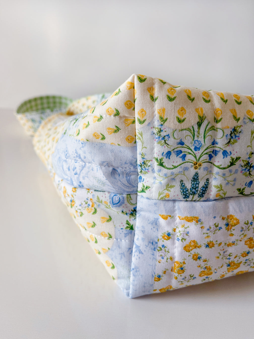 Folded fabric with floral patterns on a light background