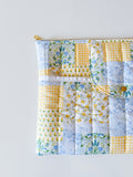 Patchwork print quilted with floral patterns on a white background